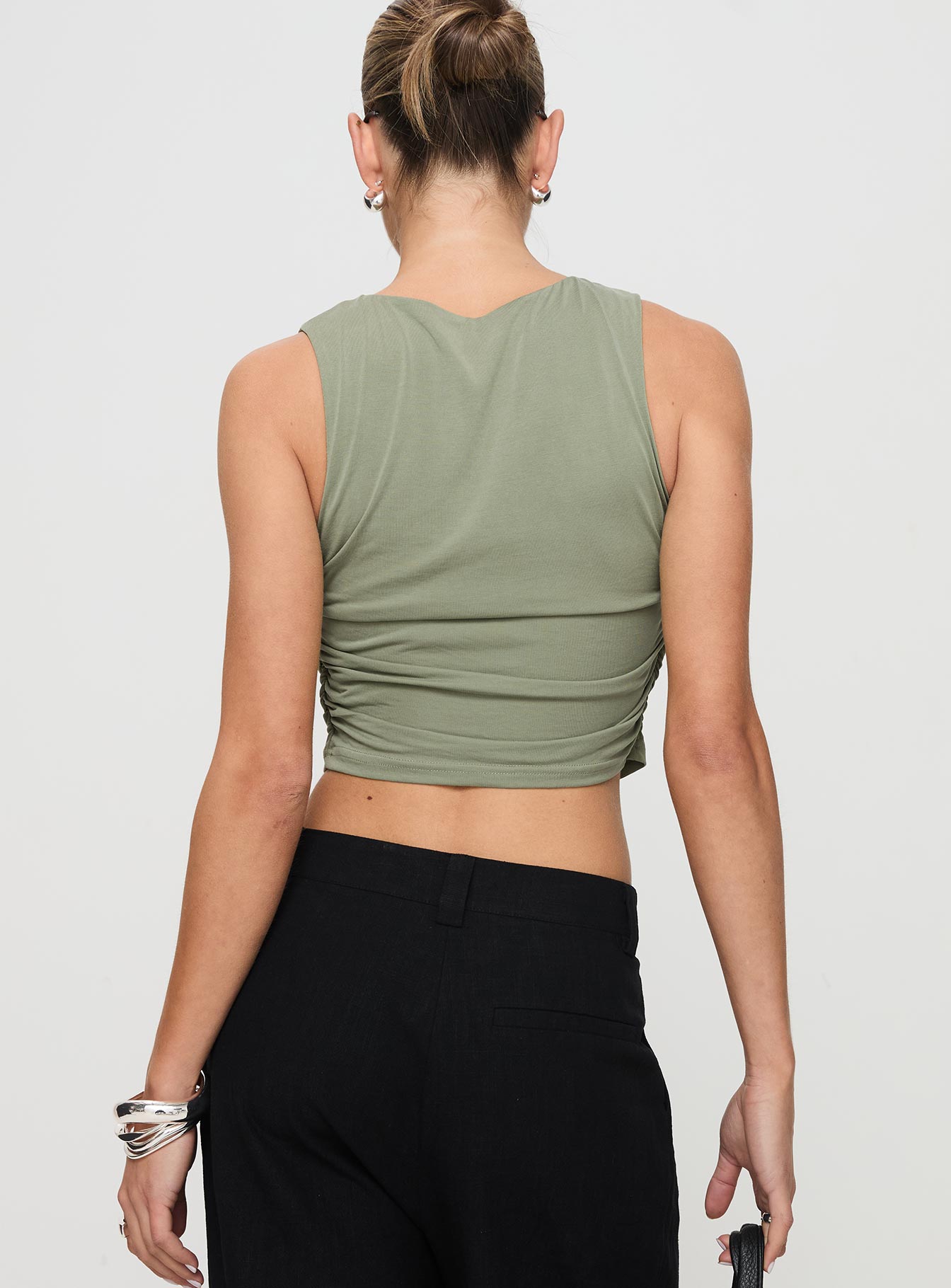 back view of model wearing Princess Polly Hold Em High Neck Top Green Sleeveless Crew Neck 