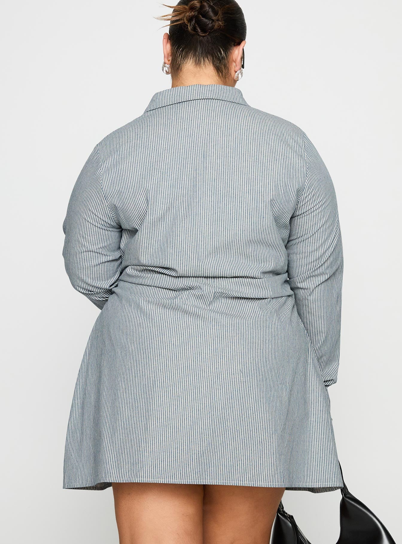 back view of model wearing Princess Polly Publicity Long Sleeve Mini Dress Blue Pinstripe Curve V-Neck 