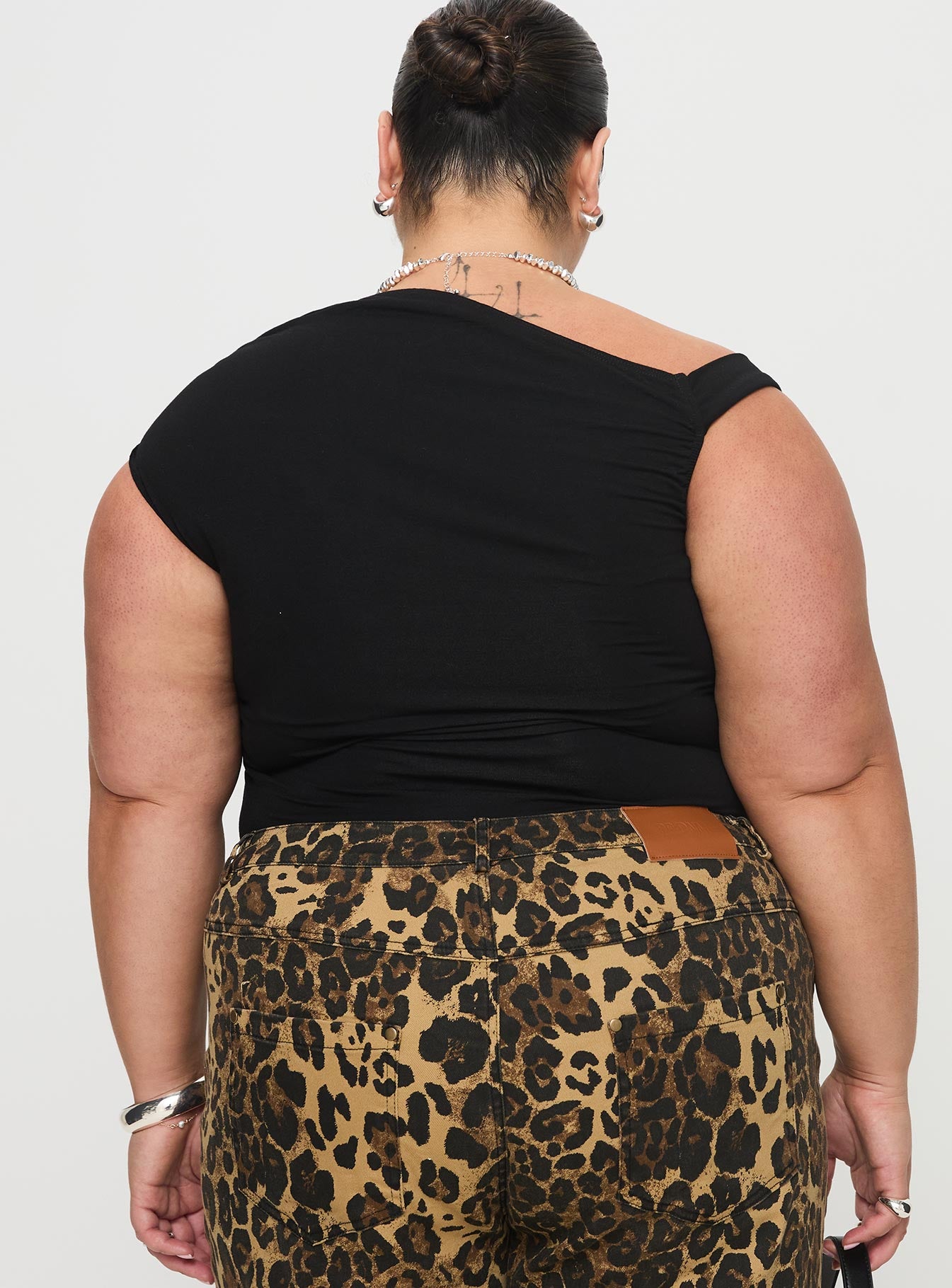 back view of model wearing Princess Polly Beller Bodysuit Black Curve Sleeveless 