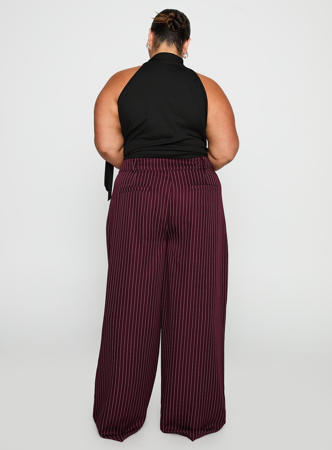 back view of model wearing Princess Polly Lorenne Mid Rise Pant Burgundy Pinstripe Curve 