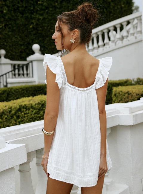 back view of model wearing Princess Polly Summerland Broiderie Mini Dress White Square Neck 