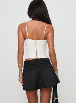 back view of model wearing Princess Polly Farfalle Mini Skirt Black Mini Skirts 