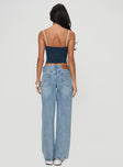 back view of model wearing Princess Polly Serenitia Mid Rise Relaxed Jeans Light Wash Petite Mid Rise 