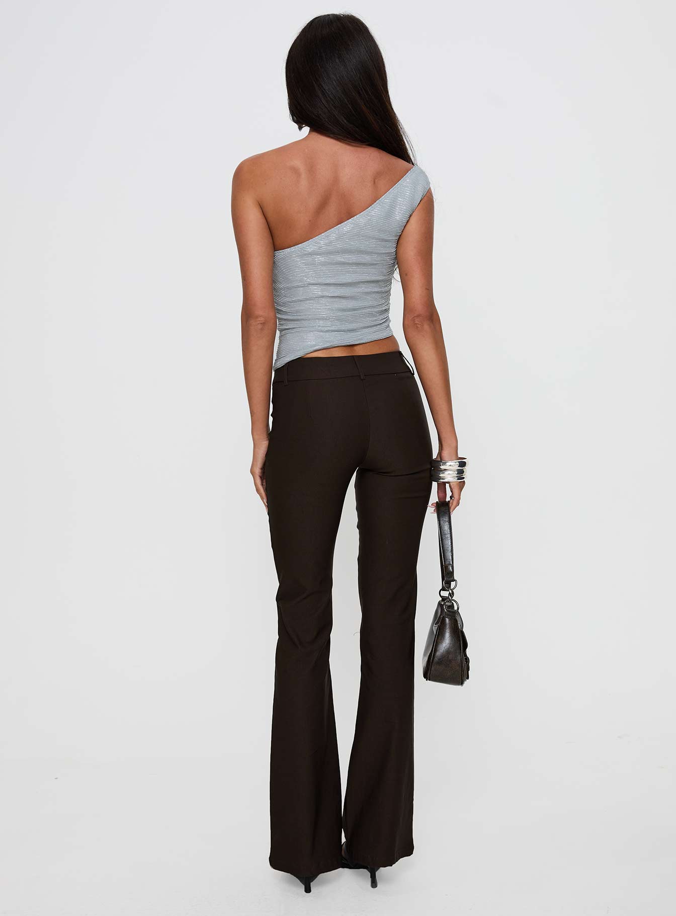 back view of model wearing Princess Polly Kinkirk Flared Pants Chocolate Tall Low Rise Pants 