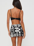 back view of model wearing Princess Polly Caraliia Mini Skirt Black / Cream Mini Skirts 