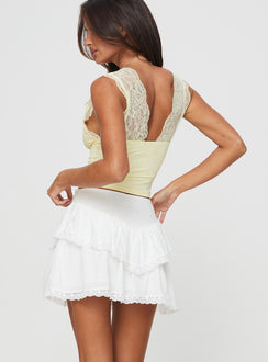 back view of model wearing Princess Polly Capshaw Mini Skirt White Mini Skirts 