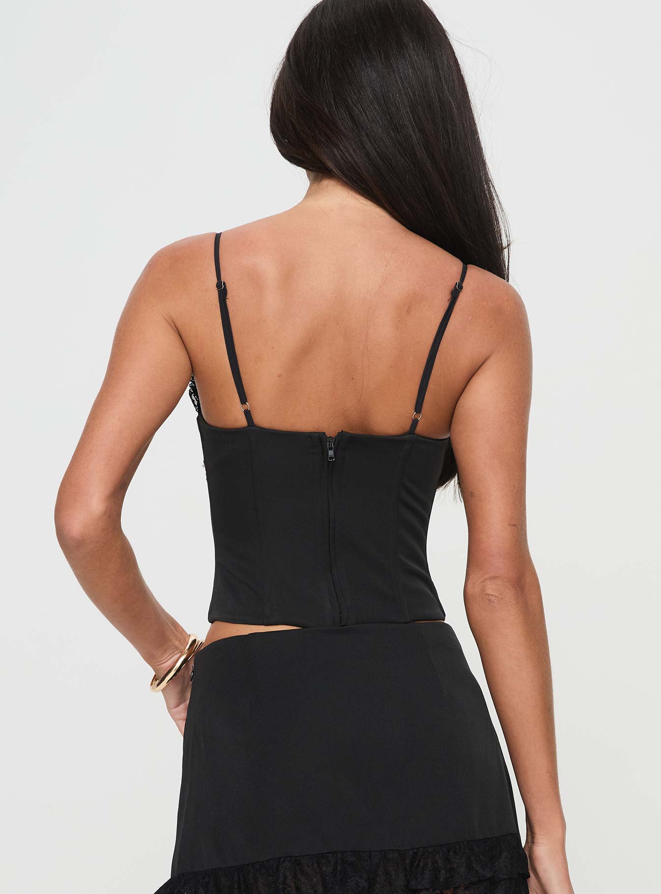 back view of model wearing Princess Polly Ferran Corset Top Black Sleeveless Sweetheart 