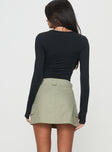 back view of model wearing Princess Polly Gonzales Mini Skirt Olive Mini Skirts 