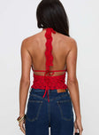 back view of model wearing Princess Polly Only Angel Halter Top Red Sleeveless Plunger 