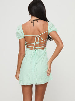 back view of model wearing Princess Polly Havena Anglaise Mini Dress Sage Square Neck 