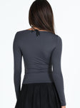 Long sleeve top Cut out at bust Good stretch Unlined 