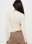 back view of model wearing Princess Polly Arnim Long Sleeve Top Cream Full Sleeves Crew Neck 