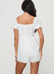 Romper Puff sleeve, square neckline, adjustable ruching at bust with tie fastening, invisible zip fastening down back Non-stretch material, partially lined Princess Polly Lower Impact