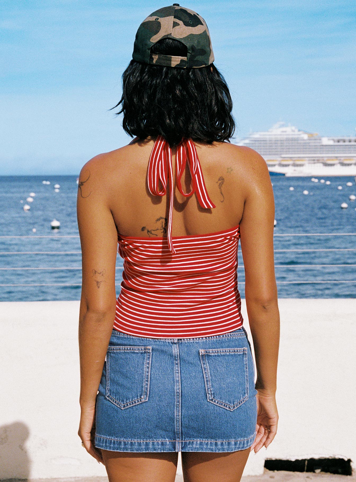 back view of model wearing Princess Polly Chameleon Halter Top Red Stripe Sleeveless V-Neck 