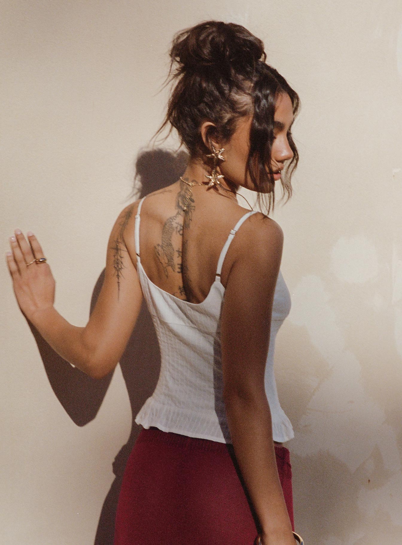 back view of model wearing Princess Polly Sonrisa Top White Sleeveless Square Neck 