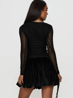 back view of model wearing Princess Polly Georgiana Bubble Hem Mini Skirt Black Mini Skirts 