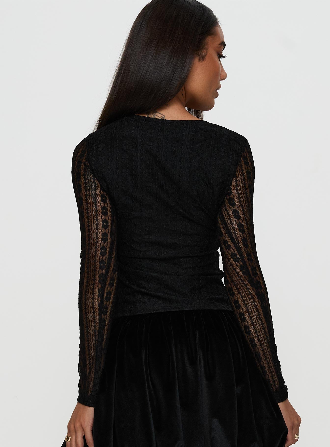 back view of model wearing Princess Polly Worth My Time Tie Neck Cut Out Top Black Full Sleeves High Neck 