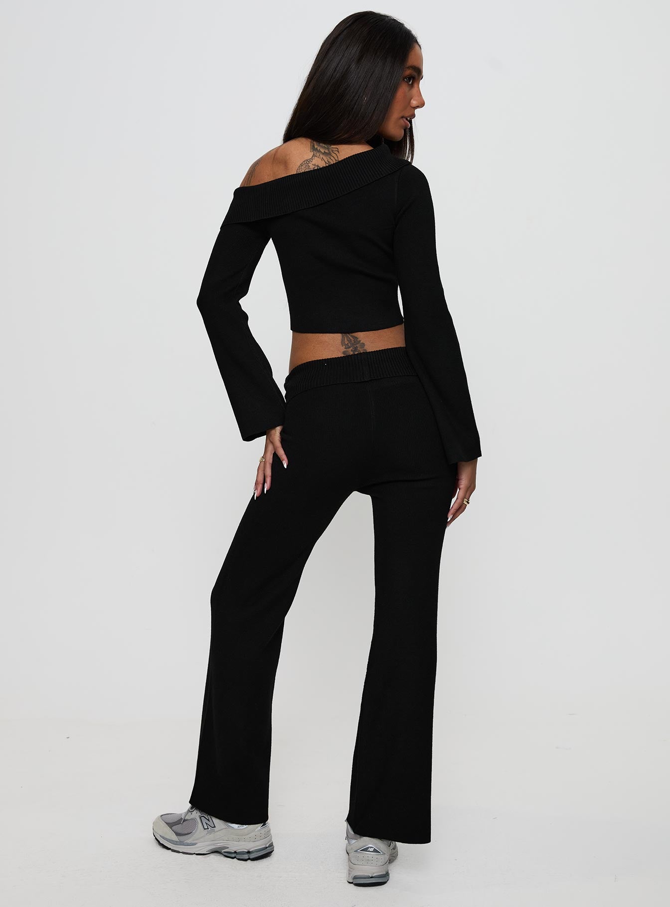 back view of model wearing Princess Polly Try Me Knit Pants Black Low Rise Pants 