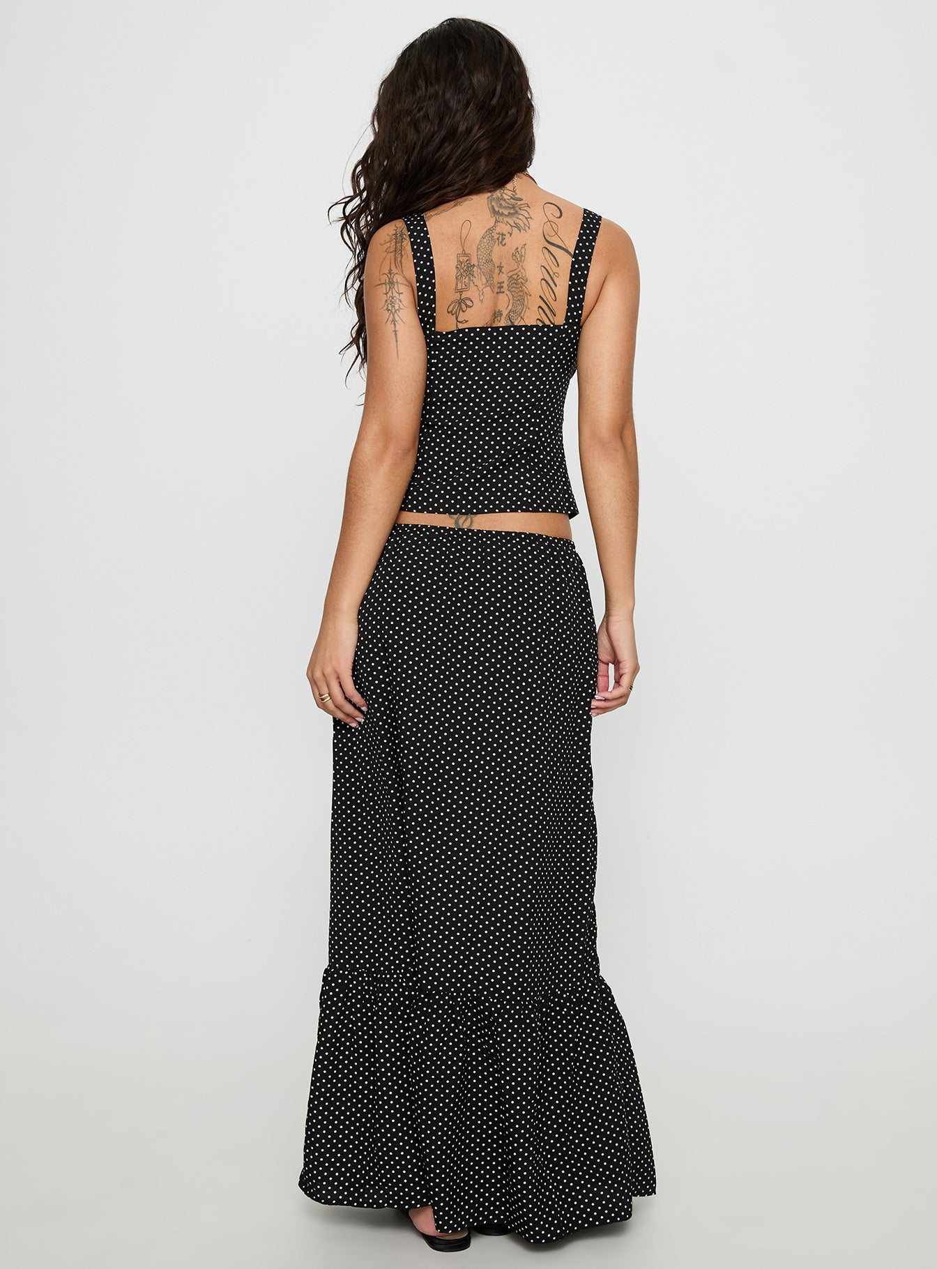 back view of model wearing Princess Polly Modern Girl Maxi Skirt Black / Polka Dot 