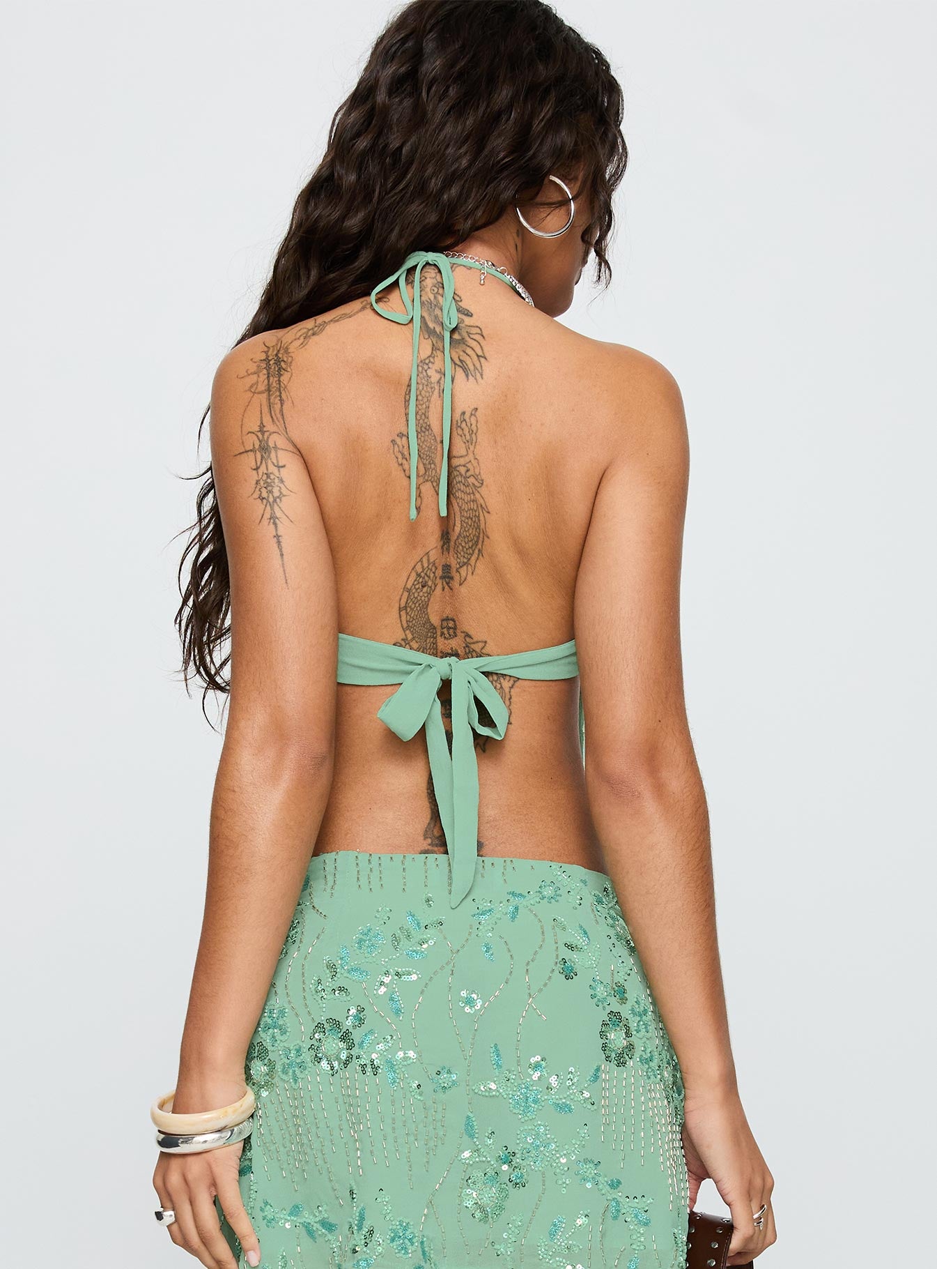 back view of model wearing Princess Polly What A Coincidence Beaded Top Teal Sleeveless Plunger 