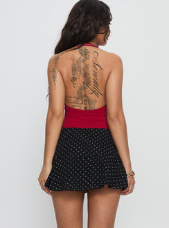 back view of model wearing Princess Polly Sonsie Mini Skirt Black / White Polka Mini Skirts 