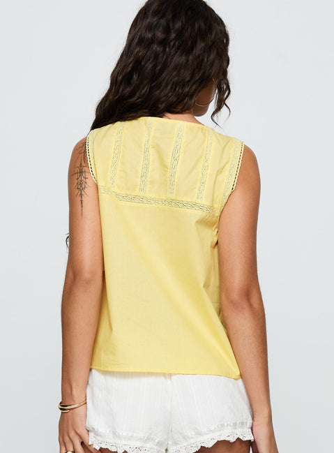 back view of model wearing Princess Polly Angourie Blouse Top Lemon Sleeveless Crew Neck 