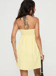 back view of model wearing Princess Polly Osment Strapless Mini Dress Lemon Straight Neck 