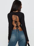 back view of model wearing Princess Polly Lifes Good Long Sleeve Backless Top Black Full Sleeves Crew Neck 