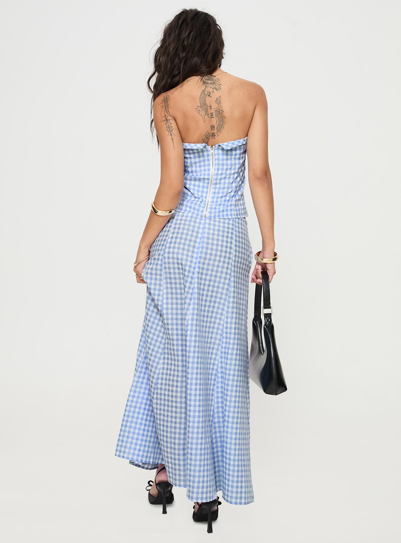 back view of model wearing Princess Polly Carmino Maxi Skirt Blue Check Midi Skirts 