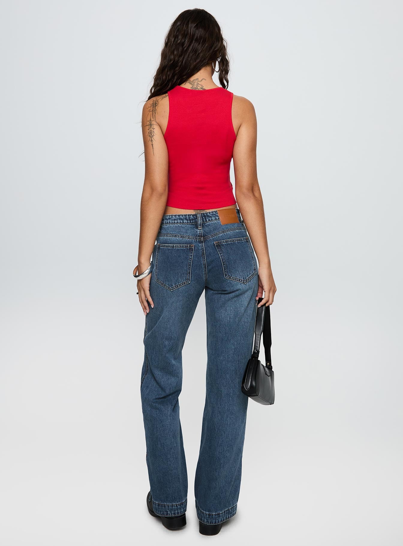 back view of model wearing Princess Polly Dog Days Mid Rise Straight Leg Jeans Dark Blue Wash Mid Rise Jeans 