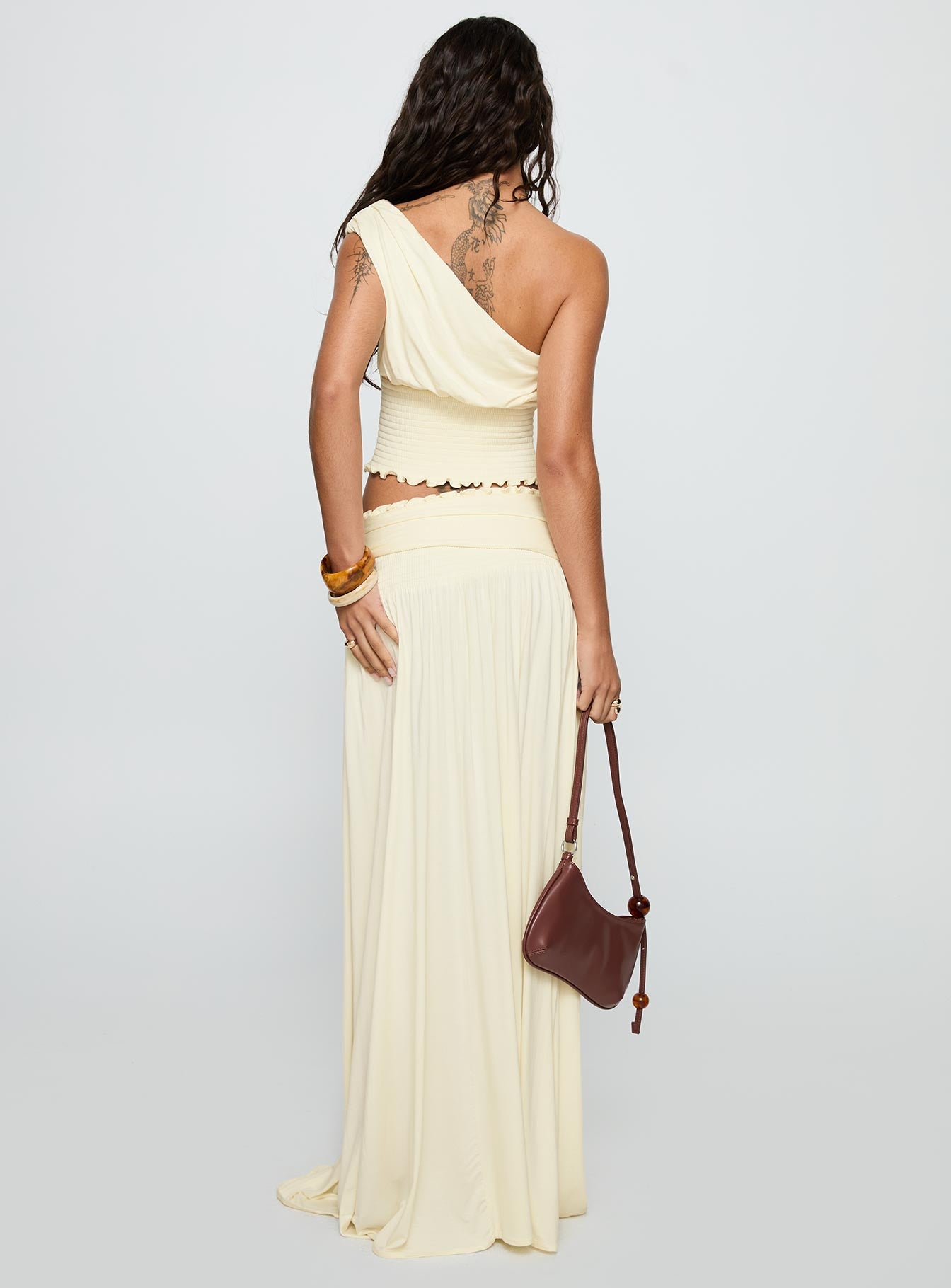 back view of model wearing Princess Polly Full Orbit Shirred Maxi Skirt Cream Maxi 