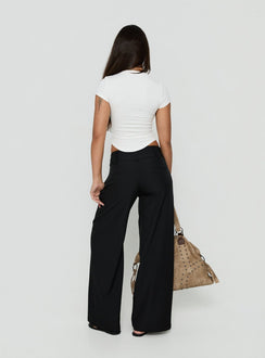 Discover Loved Up Low Rise Baggy Pants Black in womens regular pants back view of model wearing Princess Polly