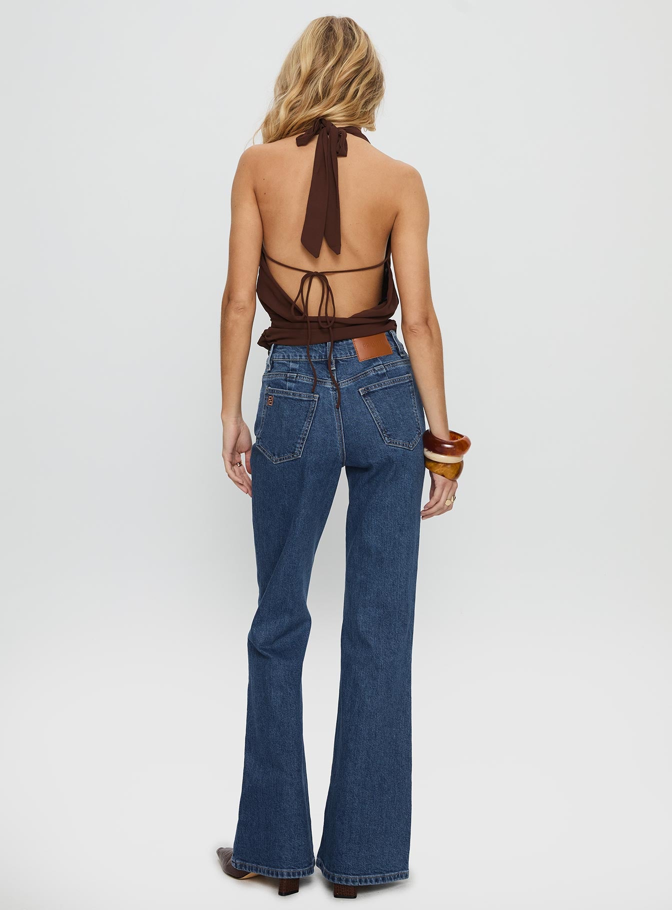 back view of model wearing Princess Polly Magic Mirror Mid Rise Bootleg Jeans Mid Blue Wash Mid Rise Jeans 