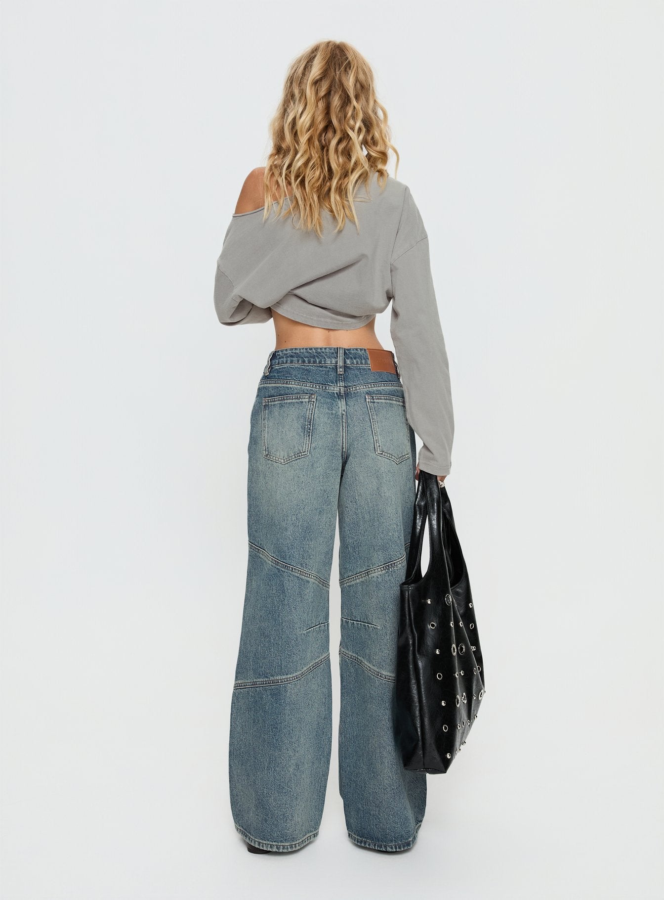 back view of model wearing Princess Polly Atmosphere Mid Rise Straight Leg Jeans Antique Wash Low Rise Jeans 