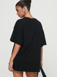 back view of model wearing Princess Polly Goal La Oversized Tee Black Half Sleeves Crew Neck 