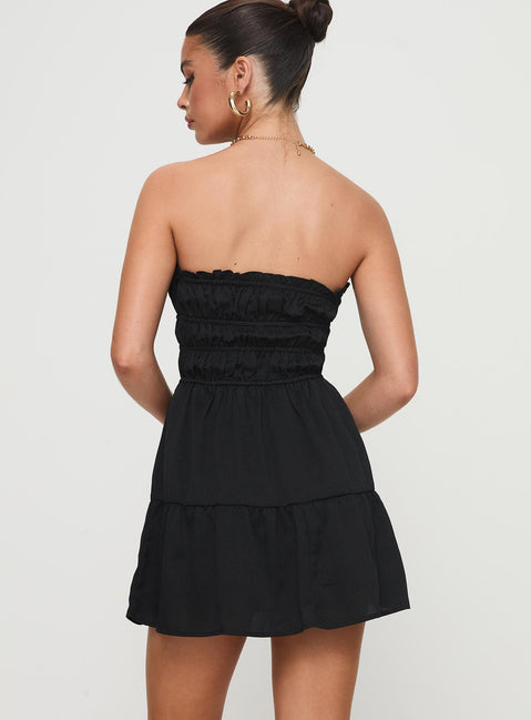back view of model wearing Princess Polly Joie Strapless Mini Dress Black Straight Neck 
