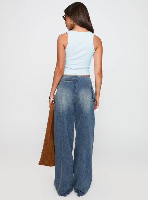back view of model wearing Princess Polly Paltrow Mid Rise Wide Leg Cargo Jeans Mid Blue Wash Petite Mid Rise Jeans 