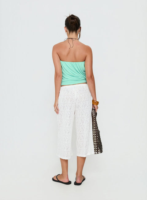 See the Kiss Me Quick 3/4 Lace Drawstring Pants in White featuring mid-rise womens-regular-pants back view of model wearing Princess Polly