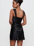 back view of model wearing Princess Polly Tremont Mini Dress Black Sweetheart Neckline 