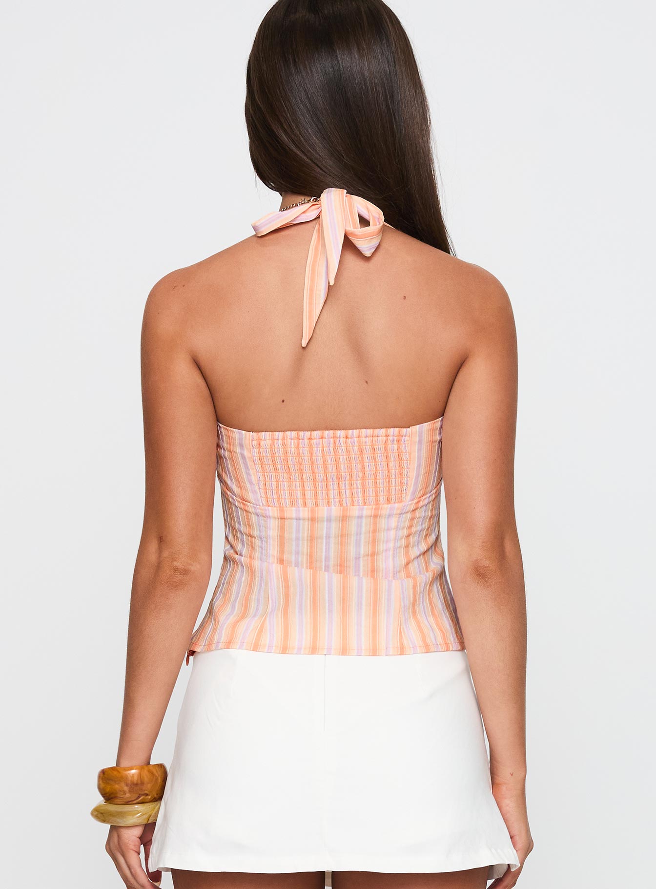 back view of model wearing Princess Polly Isabetta Halter Top Orange Stripe Sleeveless Sweetheart 