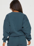 back view of model wearing Princess Polly Princess Polly Crew Neck Sweatshirt Cursive Text Navy / White 