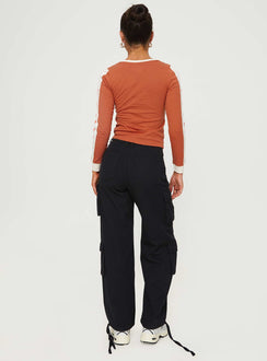 back view of model wearing Princess Polly Driscoll Cargo Pants Washed Black Mid Rise 