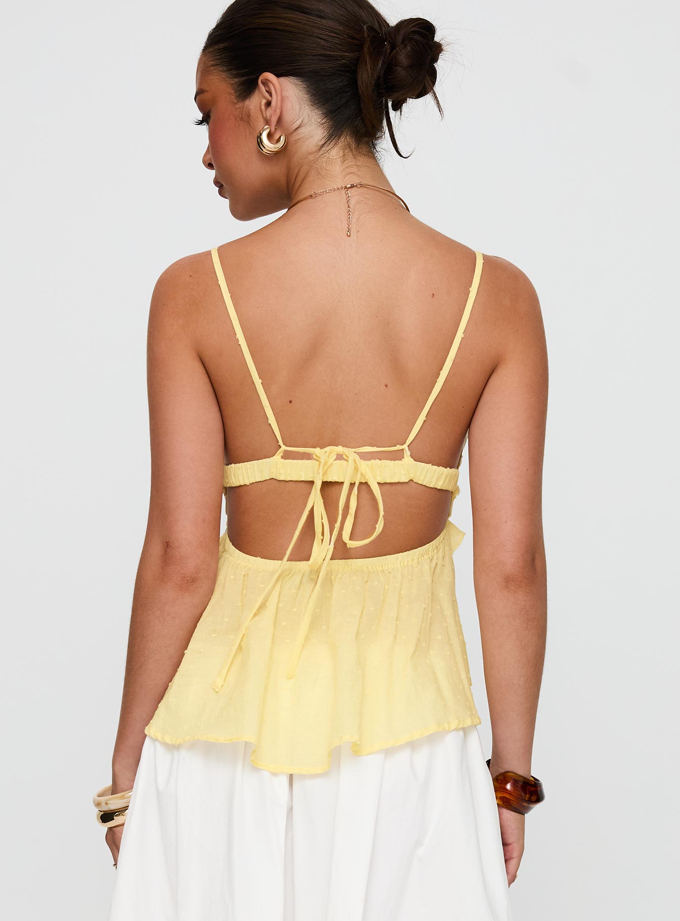 back view of model wearing Princess Polly Blondelle Frill Detail Top Yellow Sleeveless Plunger 