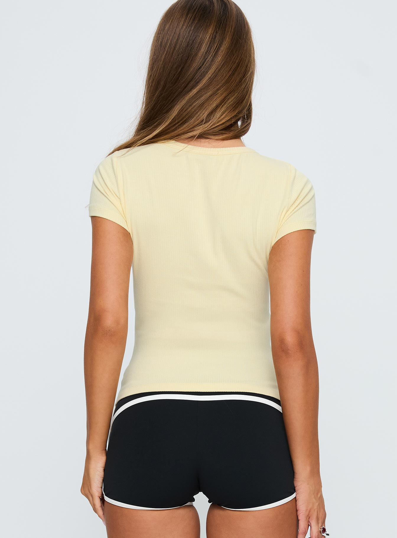 back view of model wearing Princess Polly Torina Button Up Top Lemon Short Sleeves Crew Neck 