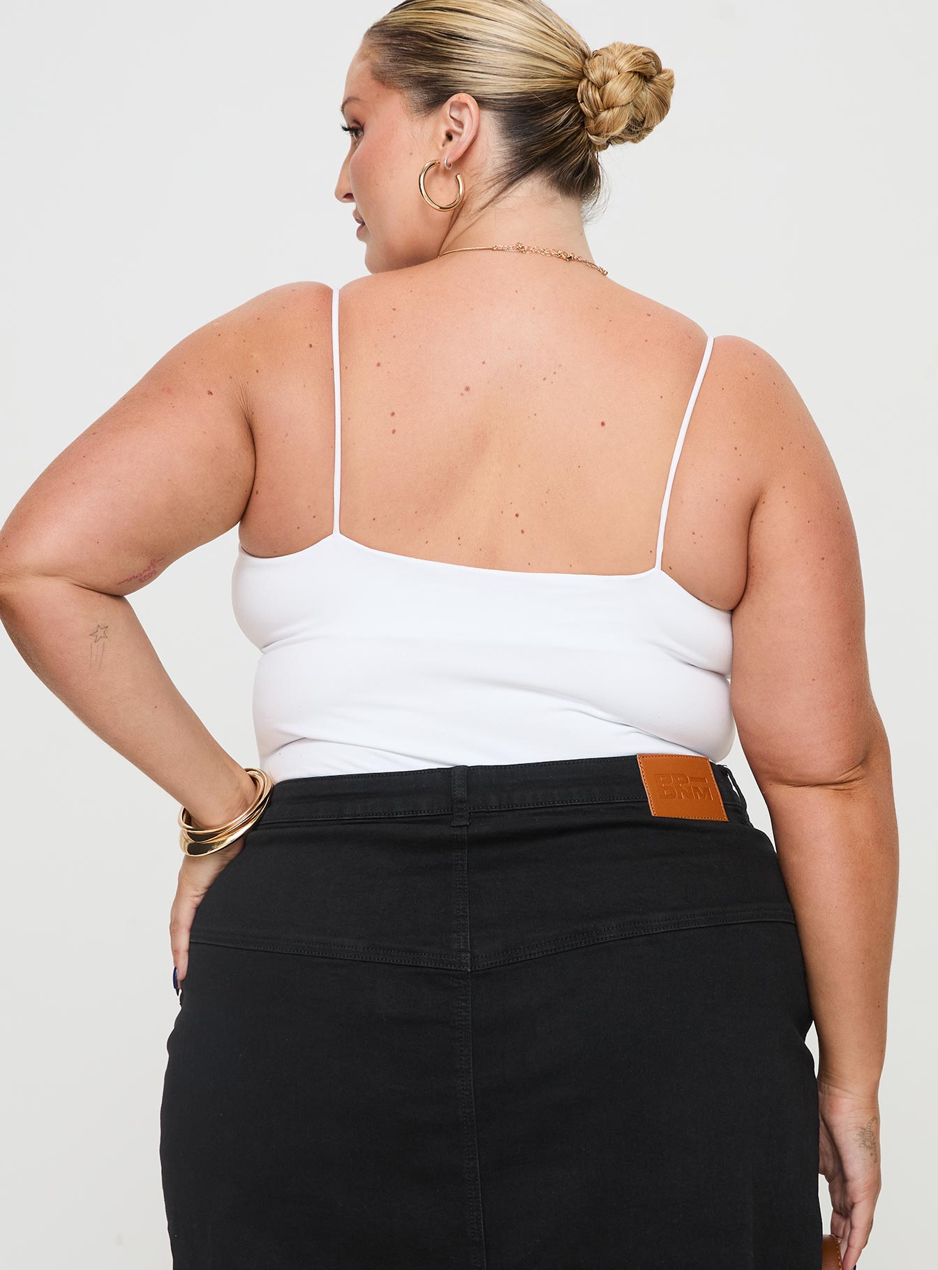 back view of model wearing Princess Polly Bekks Bodysuit White Curve Sleeveless V-Neck 