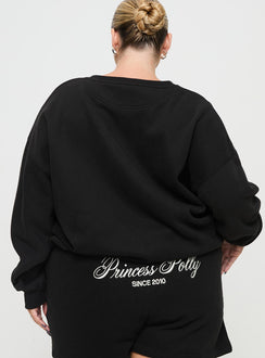 back view of model wearing Princess Polly Princess Polly Crew Neck Sweatshirt Cursive Text Black Sand Curve 