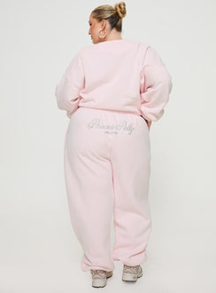 back view of model wearing Princess Polly Princess Polly Track Pants Script Baby Pink / Grey Curve 