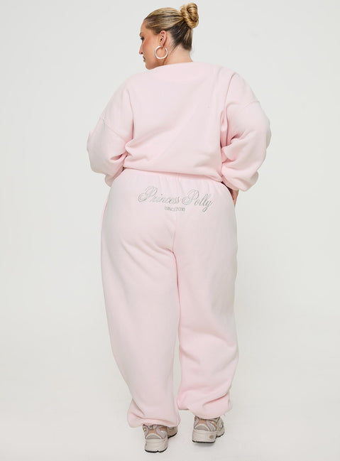 back view of model wearing Princess Polly Princess Polly Track Pants Script Baby Pink / Grey Curve 