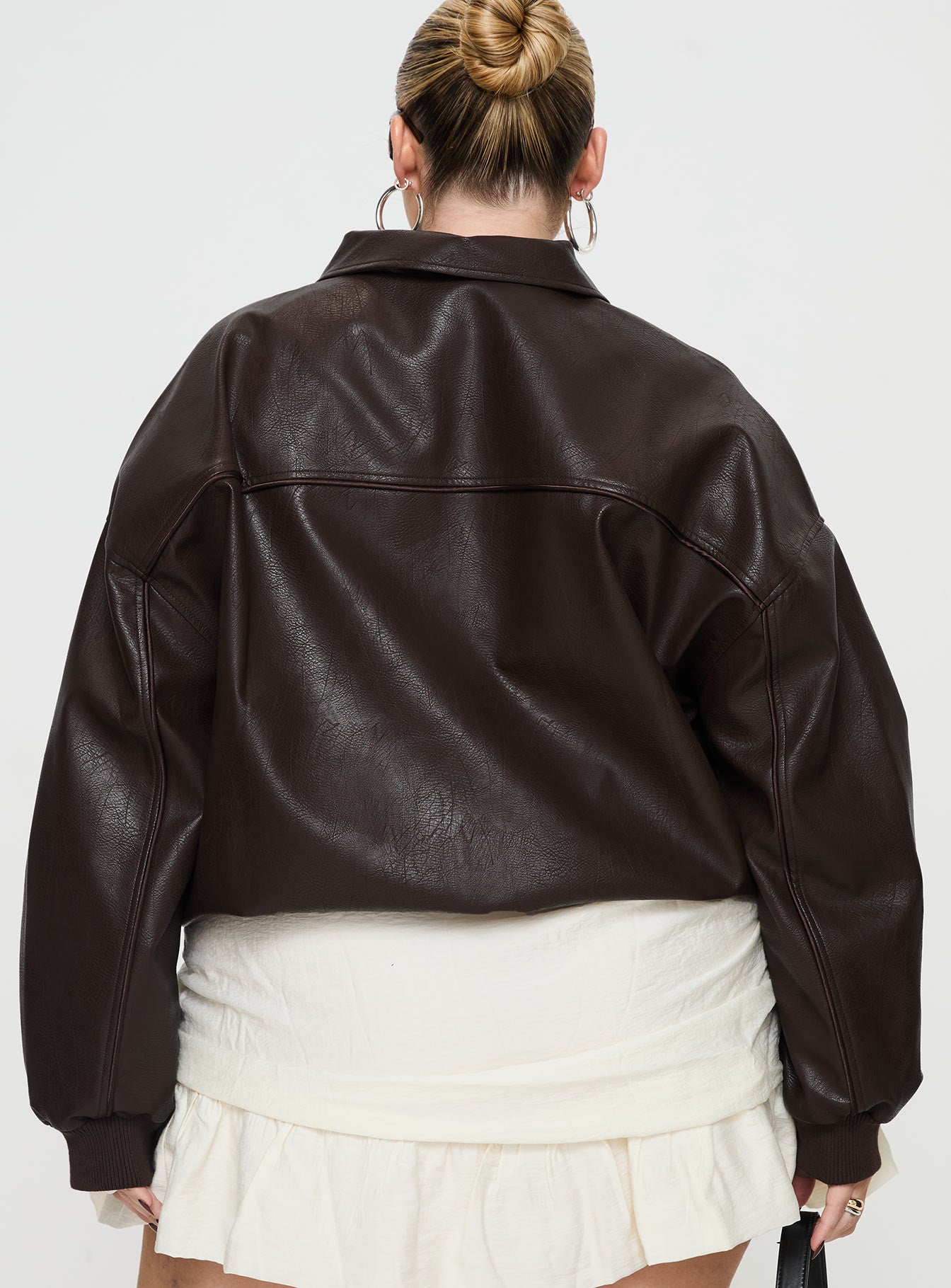 Brown Bomber jacket Oversized fit, faux leather material, classic collar, zip front fastening, ribbed waistband and cuffs, twin hip pockets