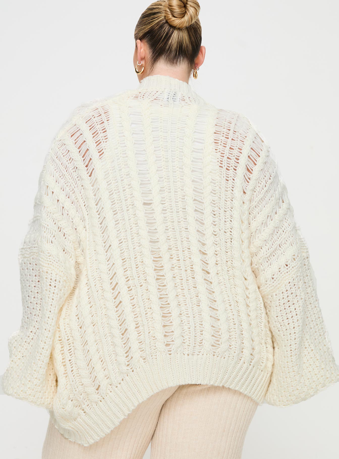 back view of model wearing Princess Polly Abner Cable Cardigan Cream Curve 